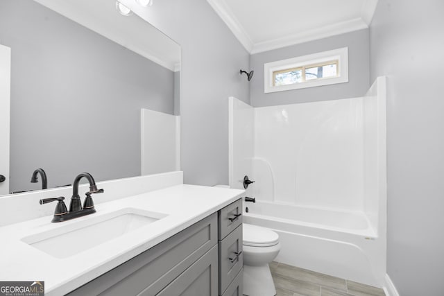 full bathroom with toilet, vanity, washtub / shower combination, wood-type flooring, and ornamental molding