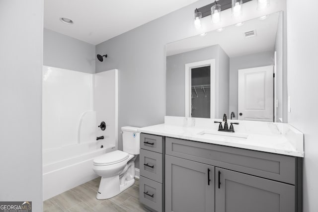 full bathroom featuring shower / bathing tub combination, vanity, and toilet