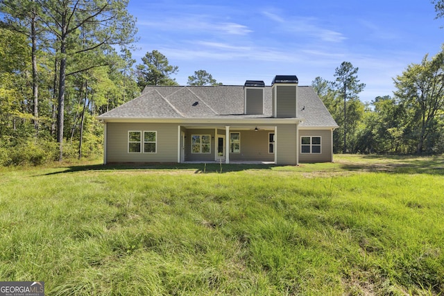 back of house with a patio