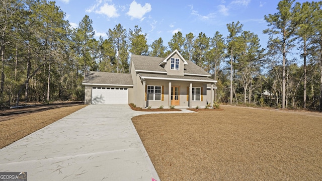 view of front of house with a garage and a porch