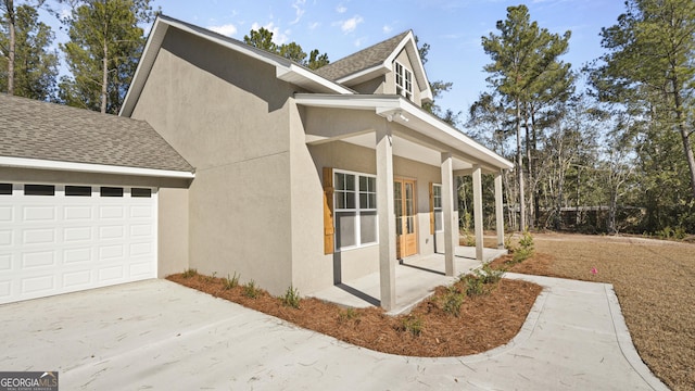 view of side of home with a garage