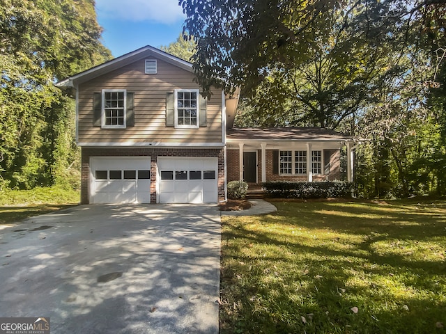 split level home with a front yard and a garage