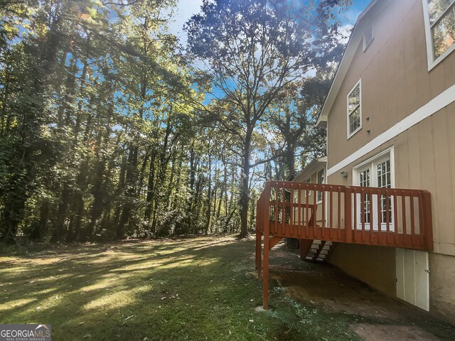 view of yard featuring a wooden deck