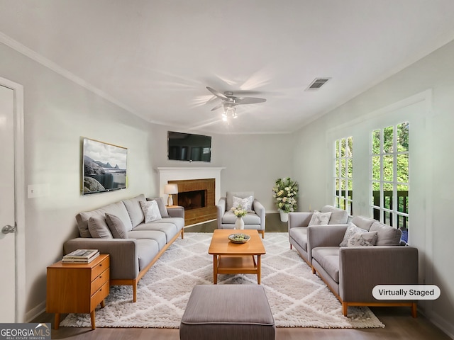 living room featuring ceiling fan and hardwood / wood-style flooring