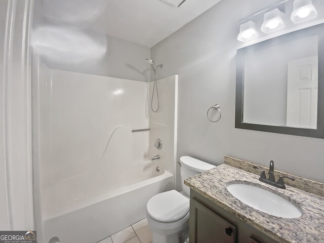 full bathroom featuring vanity, tile patterned floors, toilet, and tub / shower combination