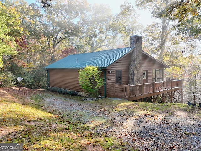 view of side of property with a deck