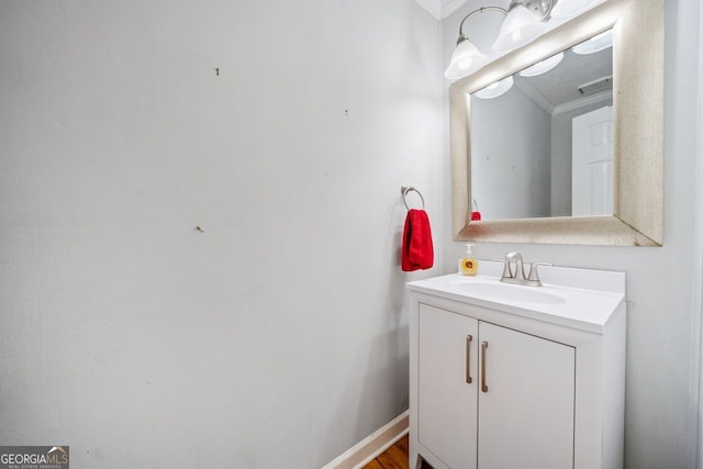 bathroom with vanity and crown molding