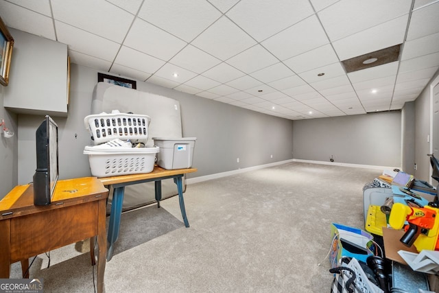 recreation room with carpet and a drop ceiling