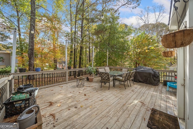 wooden deck featuring grilling area