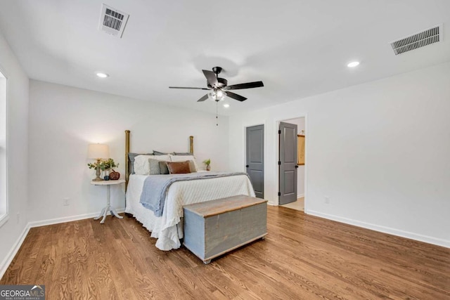 bedroom featuring hardwood / wood-style flooring and ceiling fan