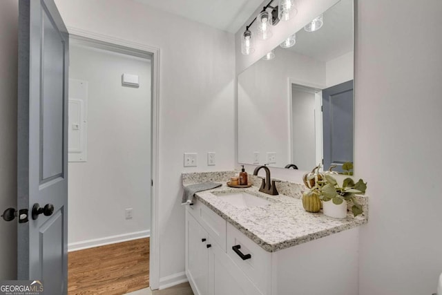 bathroom featuring vanity and wood-type flooring