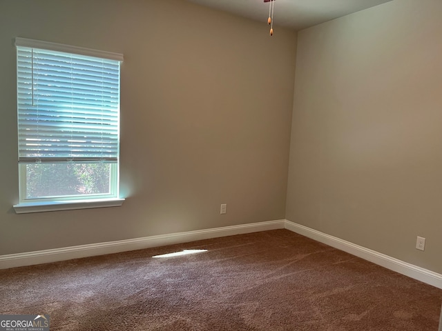 unfurnished room featuring carpet flooring and ceiling fan