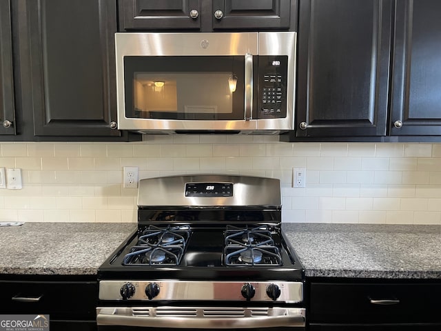 kitchen with backsplash, light stone countertops, and stainless steel appliances