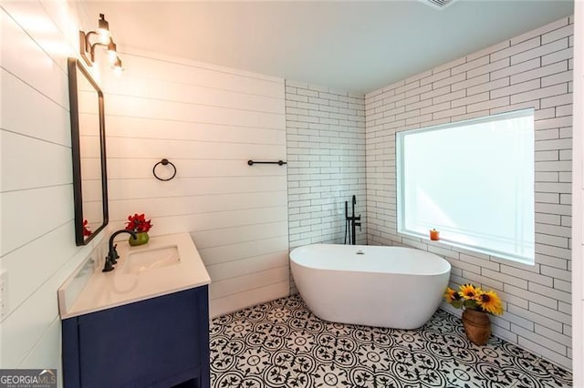 bathroom featuring vanity and a bathing tub