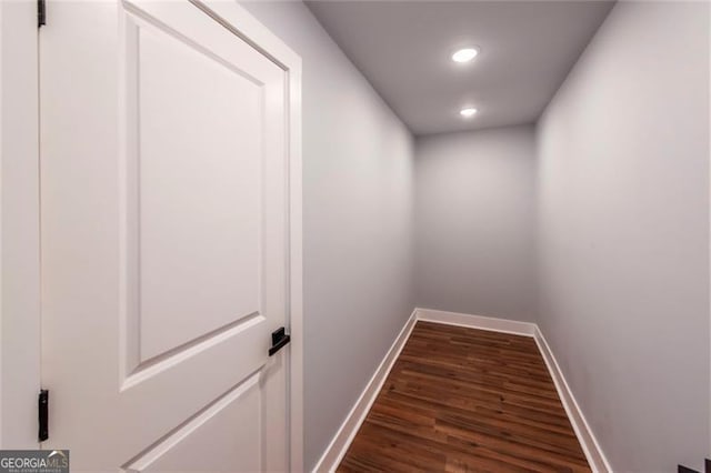 hallway with dark wood-type flooring