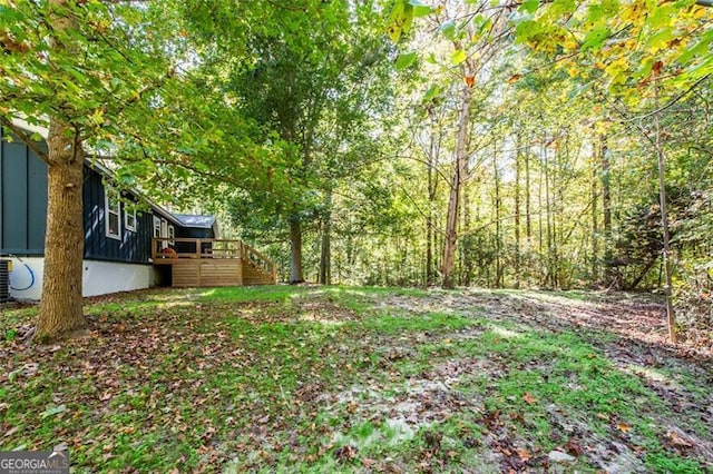 view of yard with a wooden deck