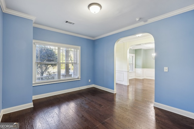 unfurnished room featuring hardwood / wood-style flooring and crown molding