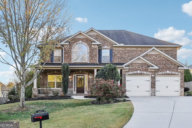 craftsman-style home featuring a garage and a front lawn