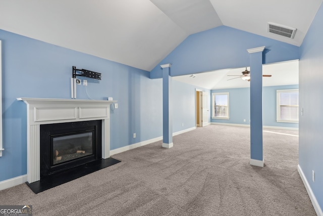 unfurnished living room with vaulted ceiling, ceiling fan, and carpet floors