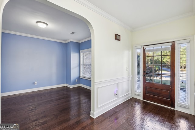 entrance foyer featuring dark hardwood / wood-style flooring and ornamental molding