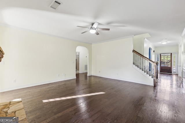 empty room featuring dark hardwood / wood-style flooring, ceiling fan, and ornamental molding