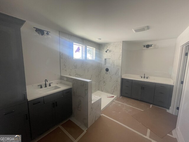 kitchen featuring appliances with stainless steel finishes, dark hardwood / wood-style flooring, wall chimney exhaust hood, white cabinets, and decorative backsplash