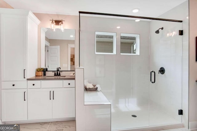 bathroom featuring vanity and walk in shower