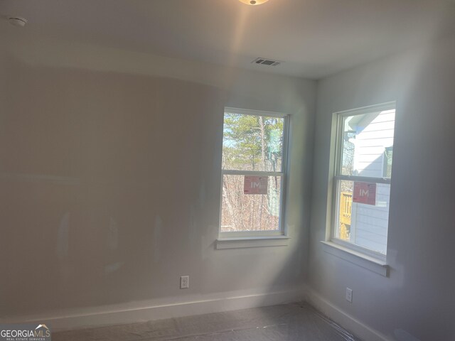 entrance foyer with a healthy amount of sunlight and wood-type flooring