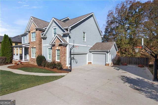 view of front property featuring a garage and a front lawn