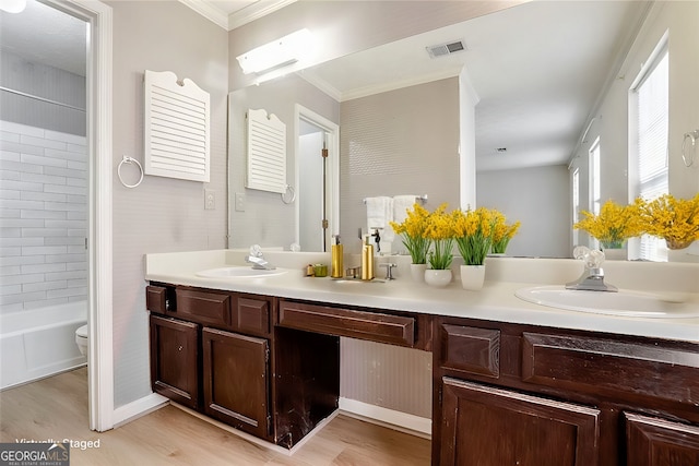 full bathroom with vanity, hardwood / wood-style floors, crown molding, and toilet