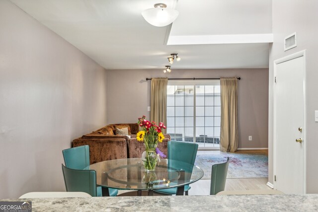 dining area featuring light wood-type flooring