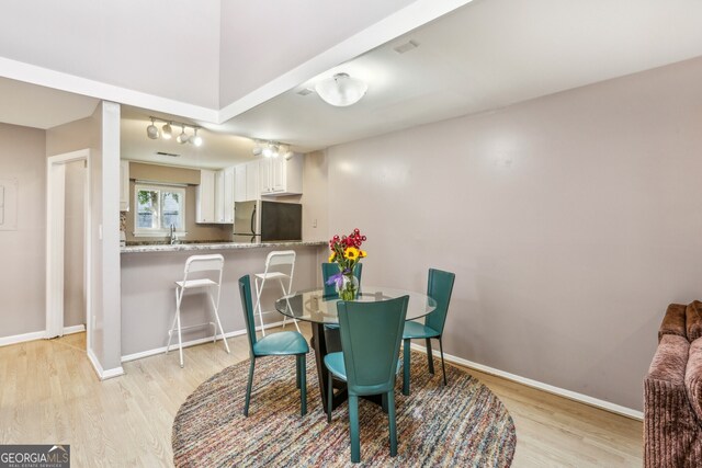 dining room with light hardwood / wood-style floors