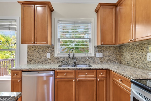 kitchen with sink, tasteful backsplash, dishwasher, and plenty of natural light