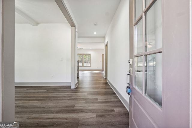 hall with dark wood-type flooring