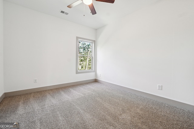 carpeted empty room with ceiling fan