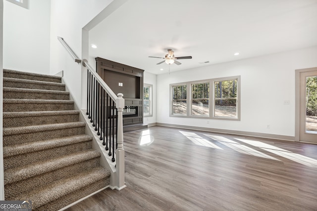 interior space featuring a wealth of natural light, hardwood / wood-style flooring, and ceiling fan