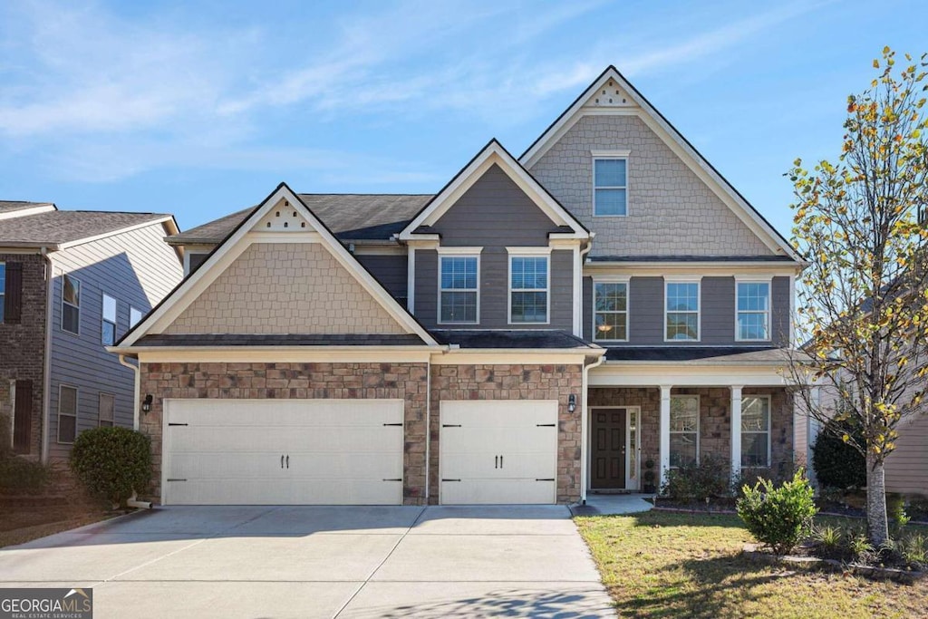 craftsman inspired home with a garage