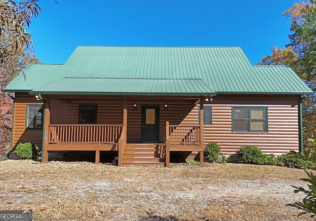 log cabin with covered porch