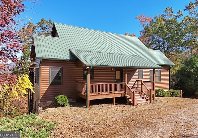 log-style house with a deck