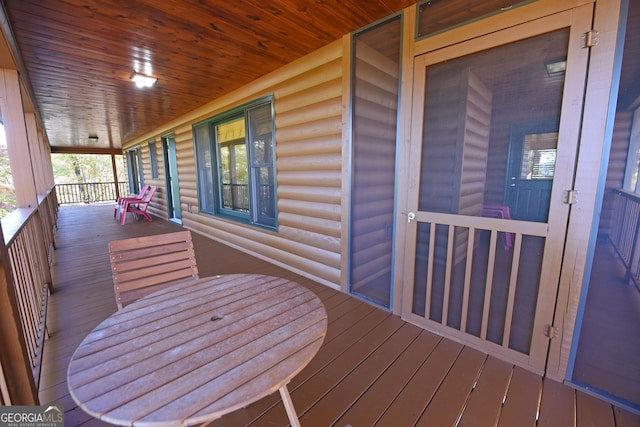 wooden terrace featuring a porch