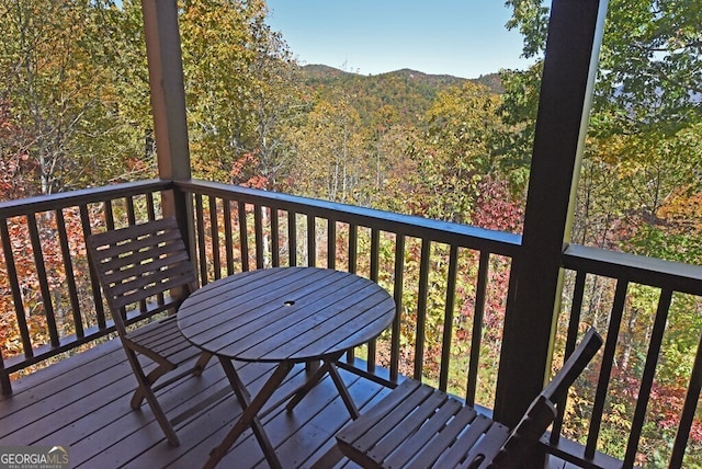 wooden terrace with a mountain view