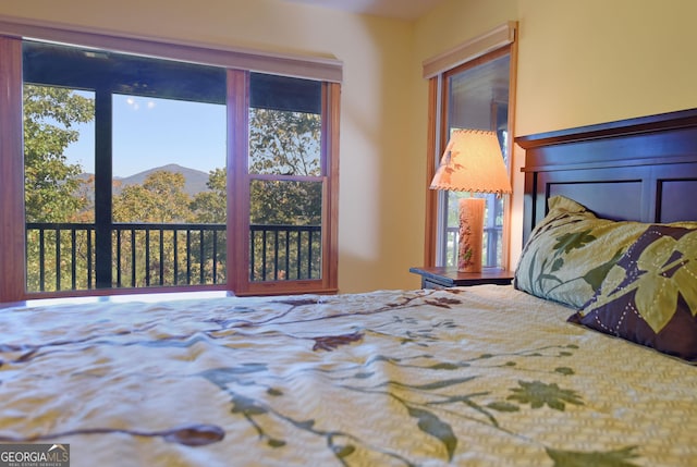 bedroom featuring a mountain view