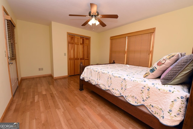 bedroom with ceiling fan and light hardwood / wood-style floors