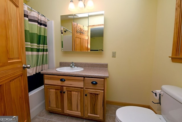 full bathroom with vanity, tile patterned floors, toilet, and shower / tub combo with curtain