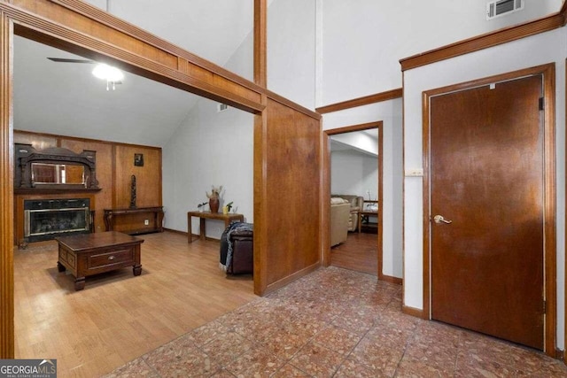 living room featuring hardwood / wood-style floors, high vaulted ceiling, and ceiling fan