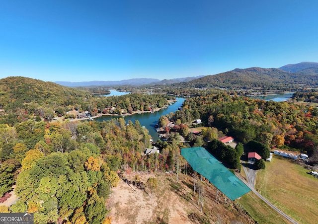 bird's eye view with a wooded view and a water and mountain view