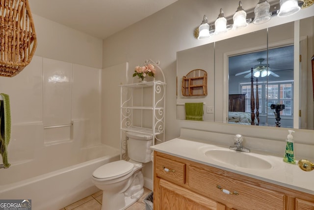 bathroom featuring a ceiling fan, toilet, vanity, tile patterned floors, and shower / bathtub combination