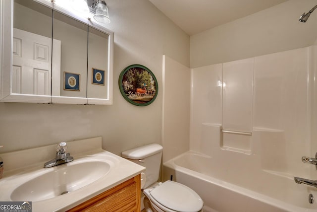 bathroom featuring bathtub / shower combination, vanity, and toilet