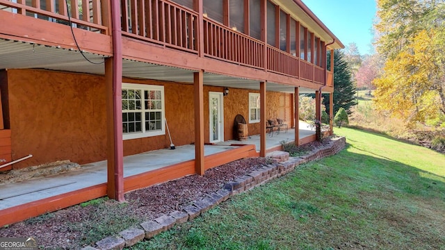 exterior space with a sunroom and a patio