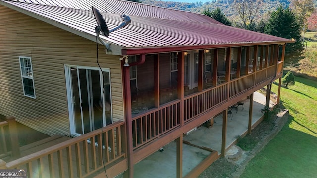 wooden terrace with a sunroom